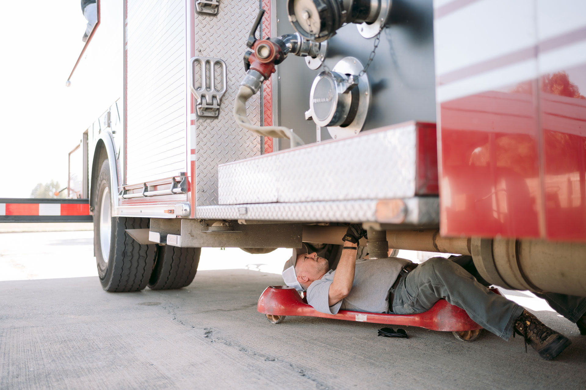 Inspecting underneath the fire truck