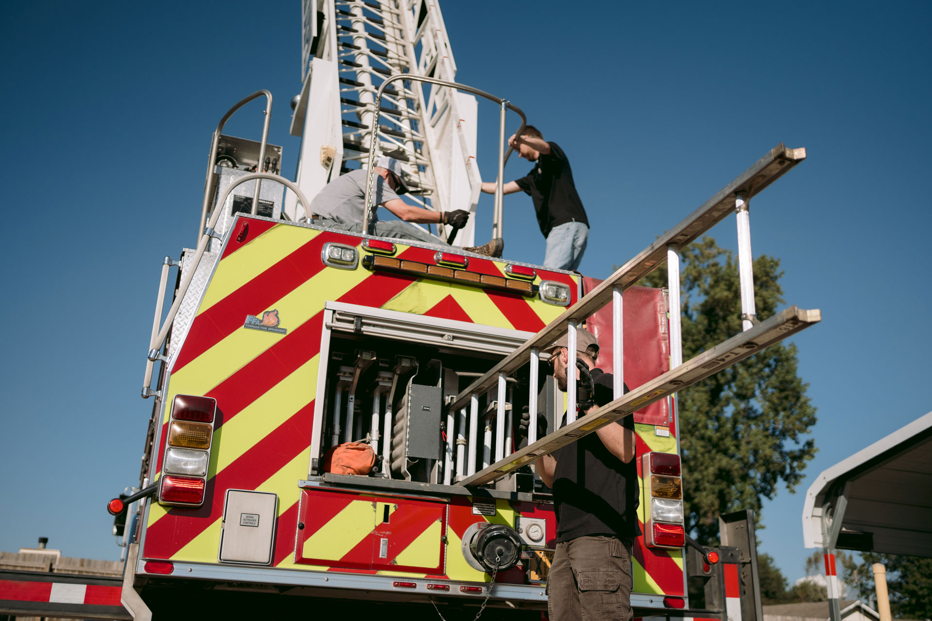 removing a fire truck ladder for testing